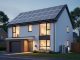 Modern home exterior with solar panels and a visible heat pump unit, photographed at dusk with warm interior light.